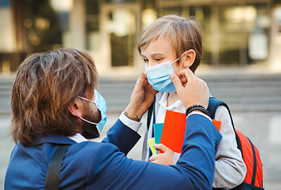 Man puts on child mask